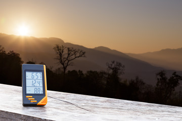 Digital display thermometer with mountain and sunlight