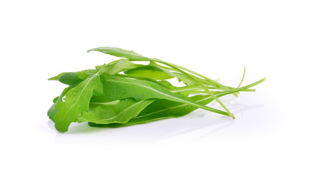 Sweet rucola salad or rocket lettuce leaves isolated on white ba