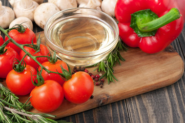 cooking background - oil, mushrooms, cherry tomatoes, pepper and