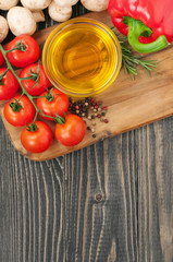 cooking background - oil, mushrooms, cherry tomatoes, pepper and