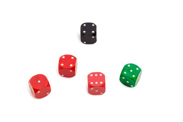 Old plastic multi colored six-sided dice with rounded corners