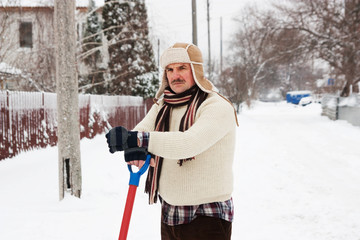 angry man clears snow