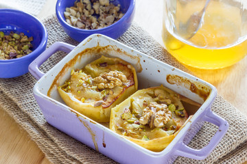 Baked apple with honey and pistachio nuts