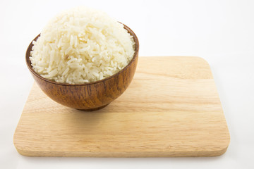 Bowl of rice on wooden isolated on white
