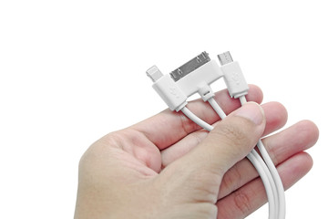 Isolated Woman hand holds several smart phone chargers