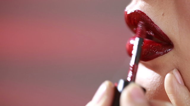 Part of attractive woman face with fashion red lips makeup. 