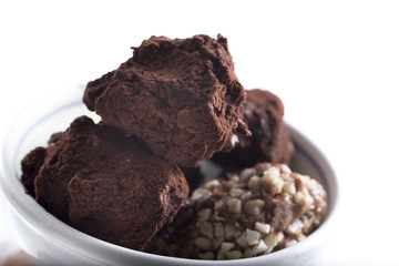 dark chocolate truffles with cocoa powder, biscuits and chopped