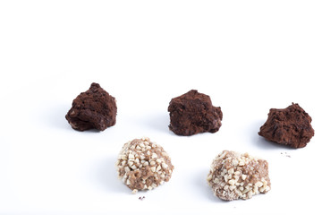 dark chocolate truffles with cocoa powder, biscuits and chopped