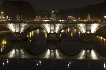 Fototapeta na wymiar image of bridge Vittorio Emanuele reflection on the river Tiber.