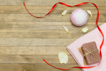 pink bath bomb and terry cloth towel  and soap