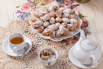 beautifully decorated table with tea and biscuits