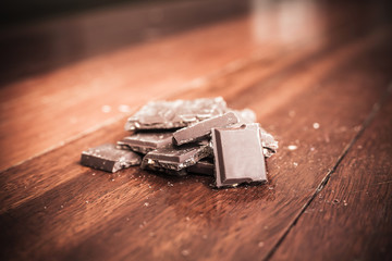 Chocolate on wood background, made vintage color tone