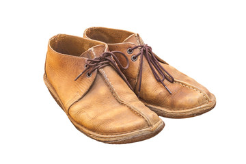 Old brown leather shoes isolate on a white background.