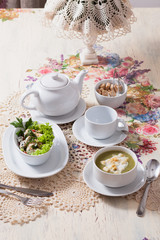 beautifully served table in vintage style with lunch - tea, soup
