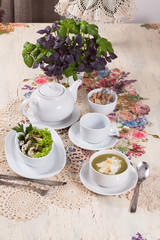 beautifully served table in vintage style with lunch - tea, soup