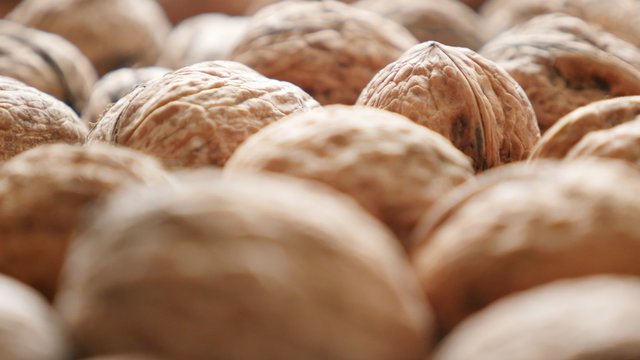 Walnuts in the hard shell natural organic food 4K 2160p 30fps UltraHD footage - Juglans regia Juglandaceae family fruit healthy autumn food 4K 3840X2160 UHD video 