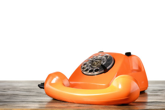 Vintage telephone on desk with isolated background