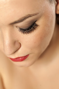 Portrait close-up on a woman's face - artificial eyelashes
