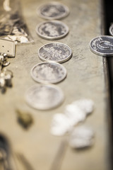 silver coins lie in a row
