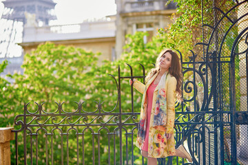 Beautiful woman on a street near the Eiffel tower in Paris