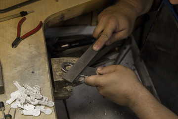 man's hands making souvenirs