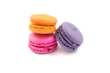 Colorful macaroons variety closeup on white background