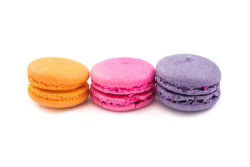 Colorful macaroons variety closeup on white background