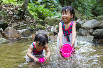Asian Little Chinese Girls Playing in Creek