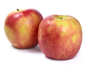 Organic red and yellow apples, isolated on white background.