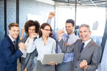 Happy business team celebrating a success