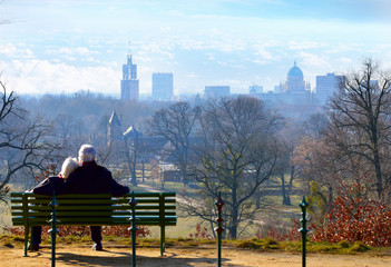 Old couple in love sitting on a bank / Potsdam city view /  Happy  pensioner / Old people in Love