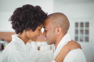 Happy couple hugging in the kitchen