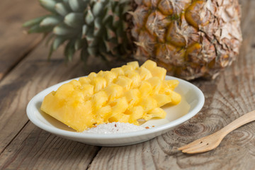 Fototapeta na wymiar Sliced Pineapple on white plate.