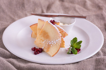 Pancakes with butter and berries cowberry