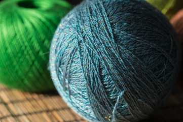 Several skeins of yarn in different colors close up