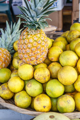 fresh orange group with an pineapple in basket from market