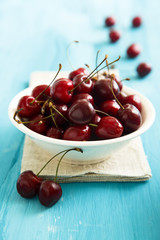 Fresh cherries in white bowl