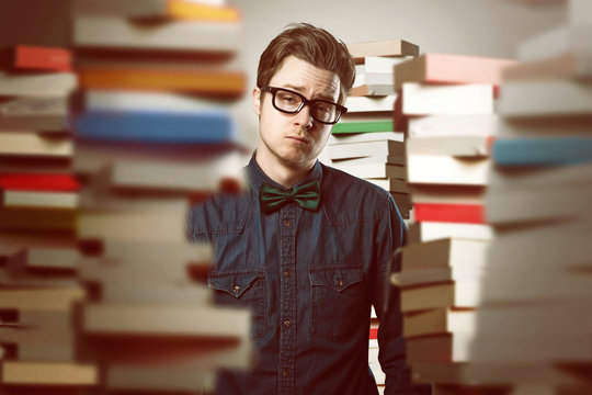 Student between book stacks
