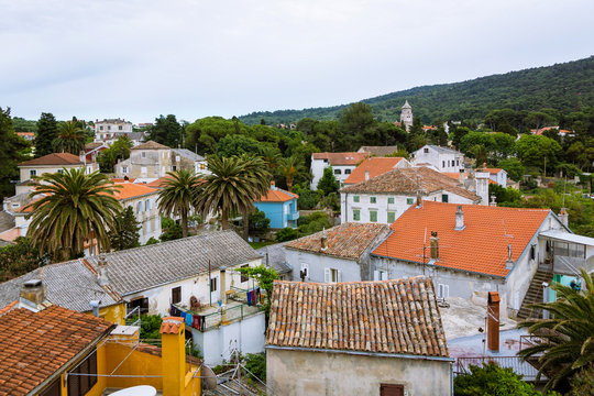 Orange roofs and colored houses in a traditional mediterranean town in Croatia