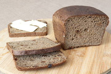 loaf of bread sliced on a cutting board