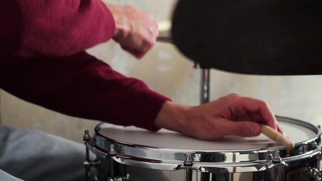 Young musician playing drums. Snare,hat and bass drum .