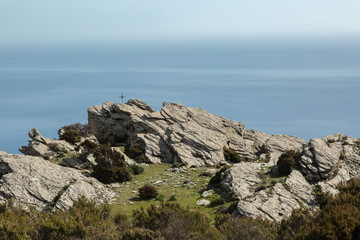 Iron cross in the mountains on the east coast of Corsica