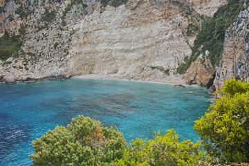 Blue water and rocks of small beach at Zakynthos island, Greece