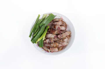 Bacon in white plate isolated on white background