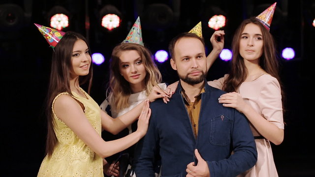 male birthday with their girlfriends posing at a birthday party