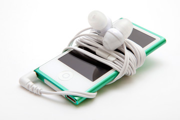 Portable musical player with headphones iisolated on the white - obrazy, fototapety, plakaty