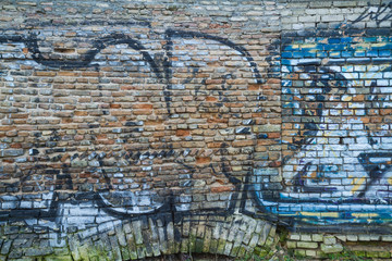 Brick wall with graffiti 