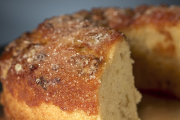 Close-up of walnuts bundt cake on a metal round tray