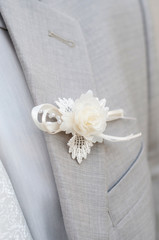 Groom gray jacket with white flower