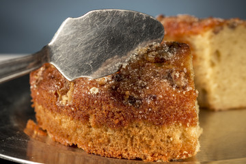 Serving piece of walnuts bundt cake